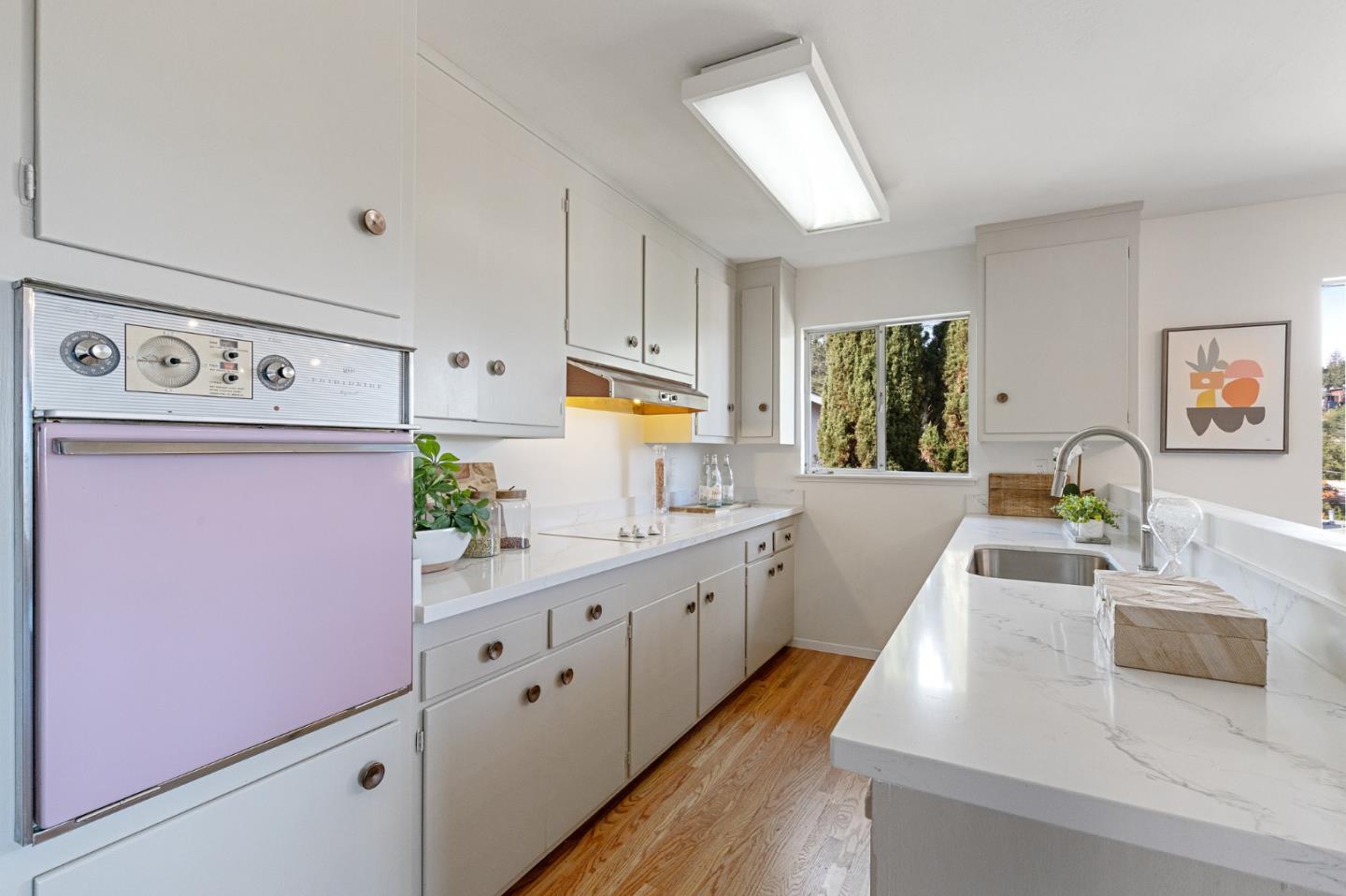 2203 Ewell Road Belmont, CA 94002 - Photo 6 of 50 a kitchen with kitchen island a sink stove and refrigerator