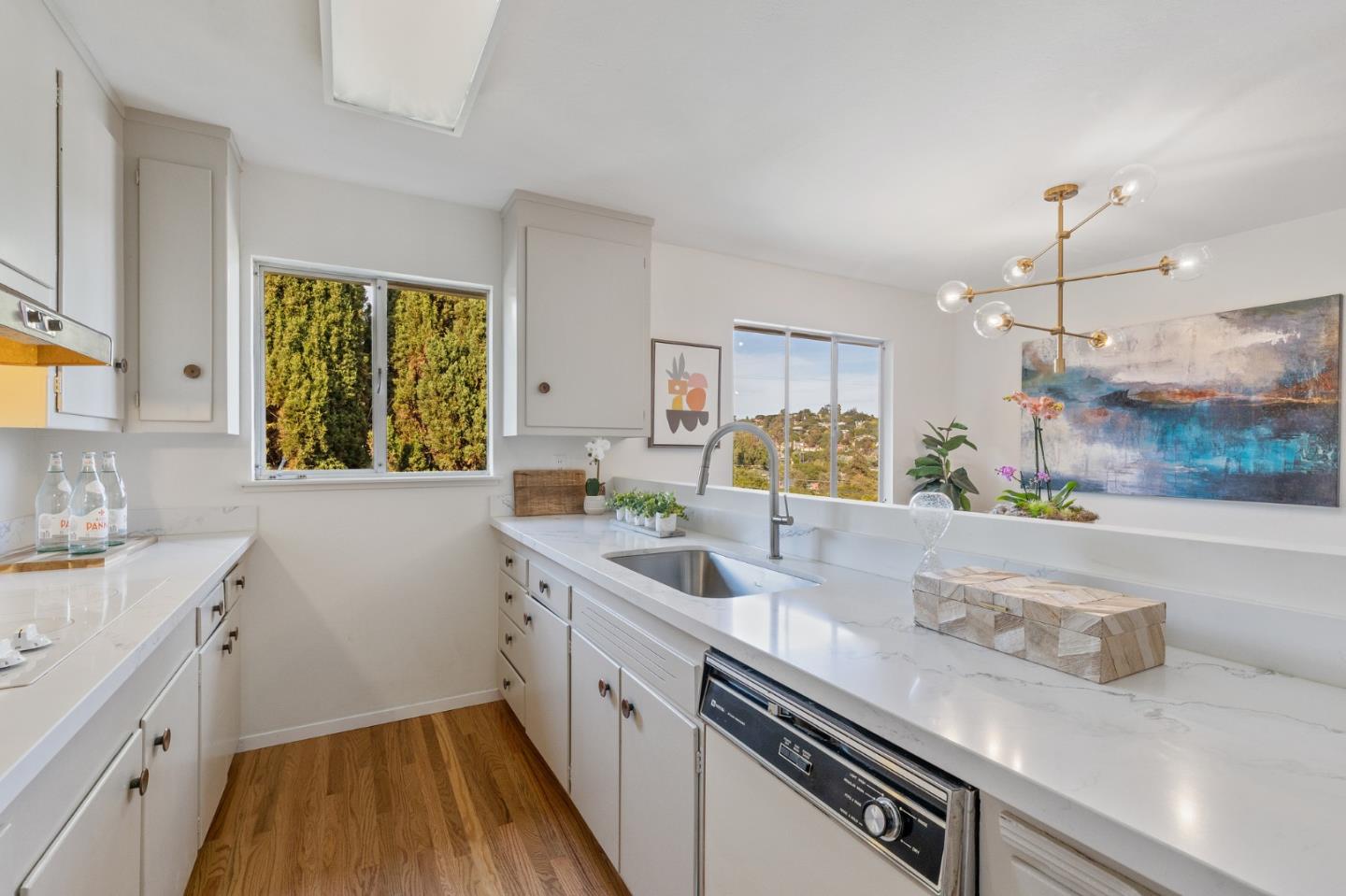 2203 Ewell Road Belmont, CA 94002 - Photo 8 of 50 a kitchen with a sink and a refrigerator