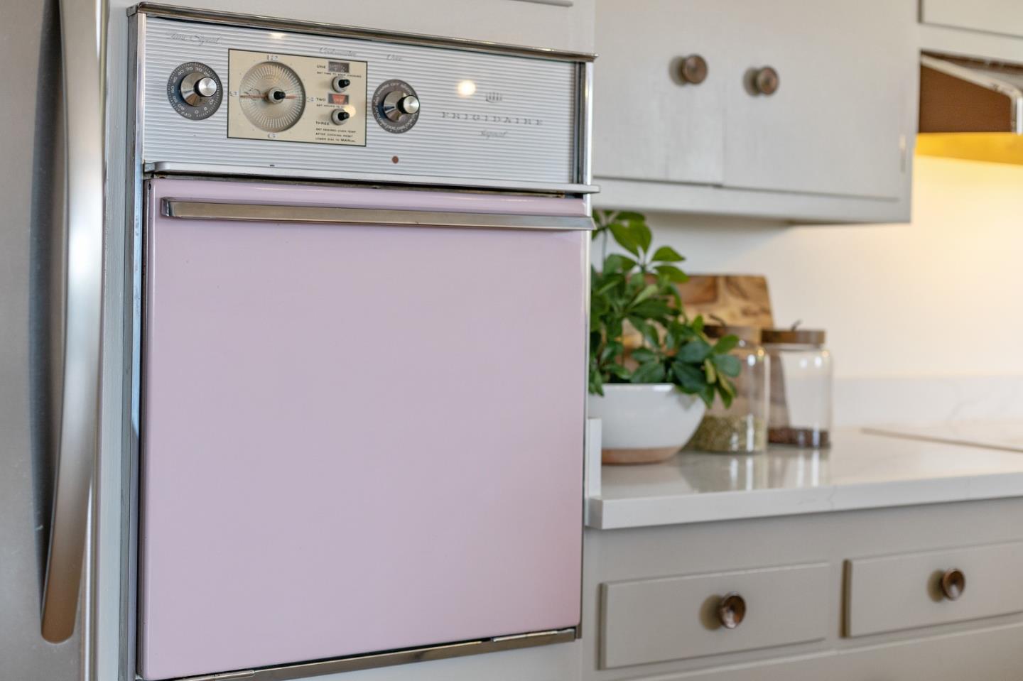 2203 Ewell Road Belmont, CA 94002 - Photo 10 of 50 a bathroom with a potted plant on the counter and a wooden floor