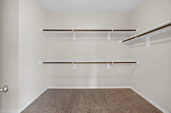 a view of an empty walk in closet