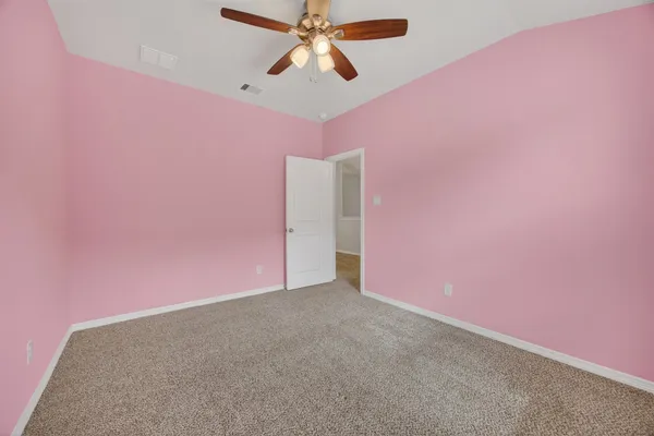 a large bedroom with furniture