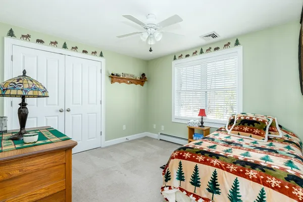 a bedroom with bed and a window