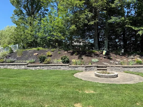 a view of a swimming pool with a yard