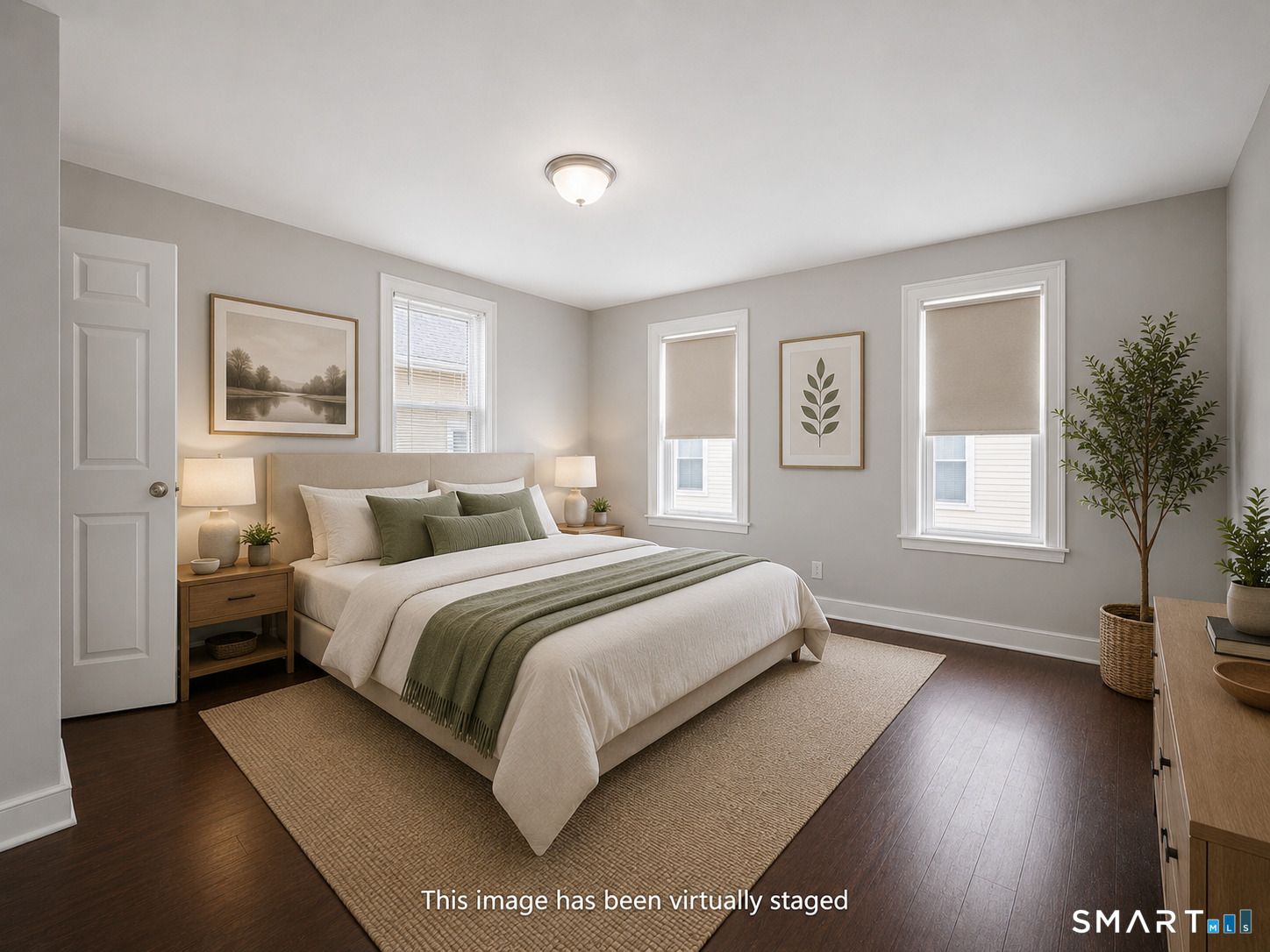 73 Orange Street Bridgeport, CT 06607 - Photo 20 of 33 a spacious bedroom with a bed and a window