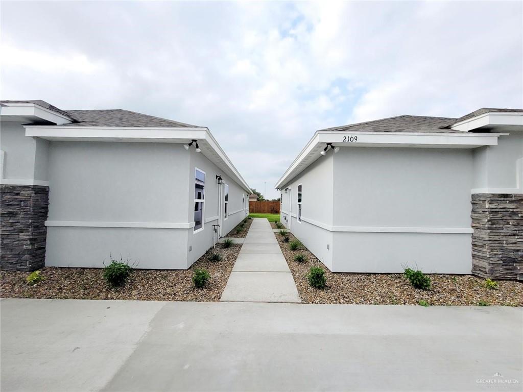 2109 Davenport Street, Unit 1 Weslaco, TX 78596 - Photo 2 of 13 a house with a outdoor space