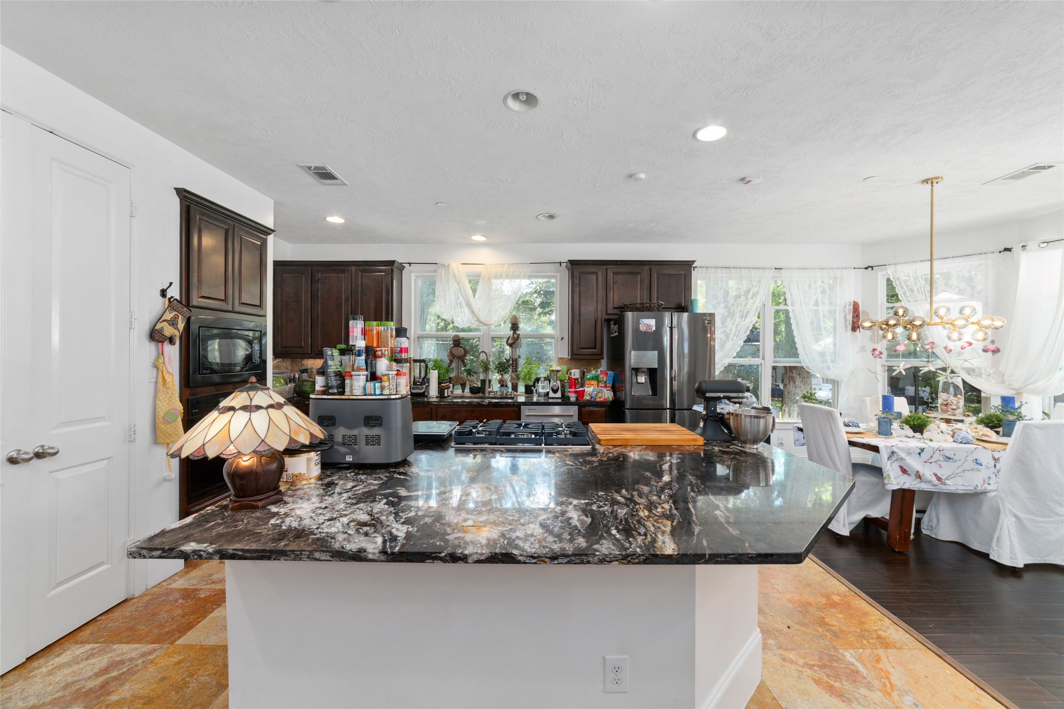 335 Voss Road Houston, TX 77024 - Photo 20 of 45 a view of living room with furniture and a chandelier