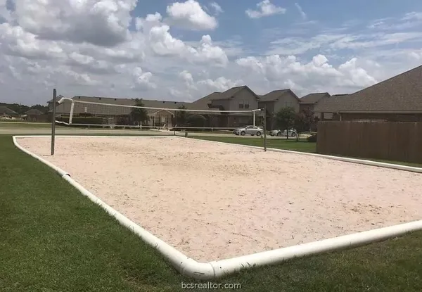 a view of swimming pool with a yard