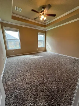 a view of empty room with windows