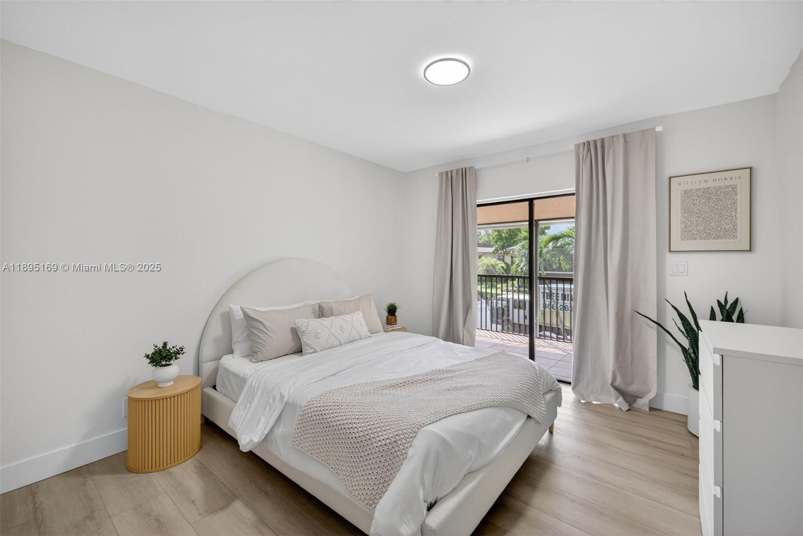 261 Deer Creek Boulevard, Unit 1205 Deerfield Beach, FL 33442 - Photo 16 of 38 a bedroom with a bed and window