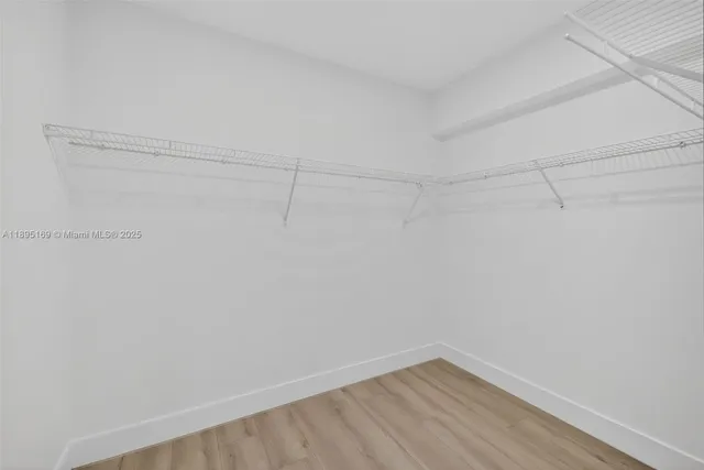 a view of a room with shelf on the wall