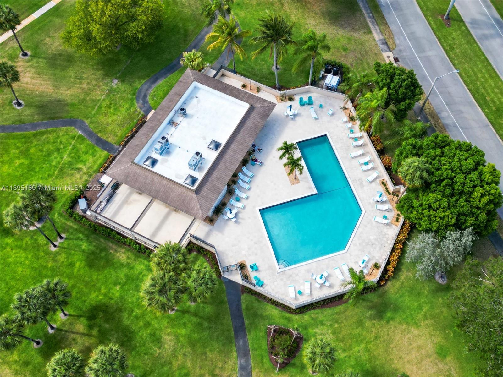 261 Deer Creek Boulevard, Unit 1205 Deerfield Beach, FL 33442 - Photo 32 of 38 an aerial view of a house with garden space and street view