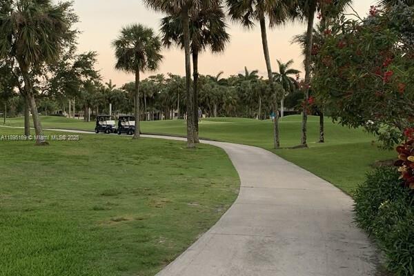 261 Deer Creek Boulevard, Unit 1205 Deerfield Beach, FL 33442 - Photo 38 of 38 a view of a park with palm trees