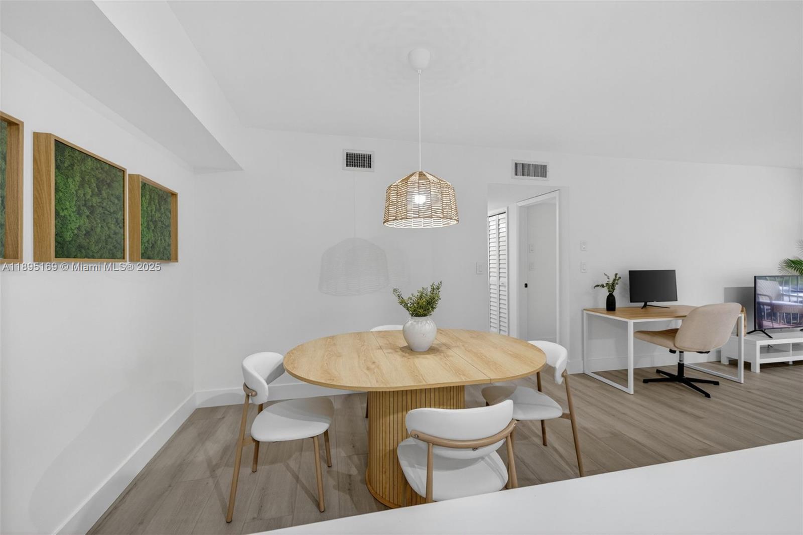 261 Deer Creek Boulevard, Unit 1205 Deerfield Beach, FL 33442 - Photo 8 of 38 a view of a dining room with furniture and wooden floor