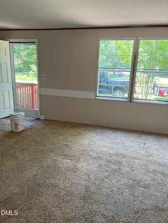 an empty room with a large window