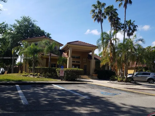 a view of a garden with a house