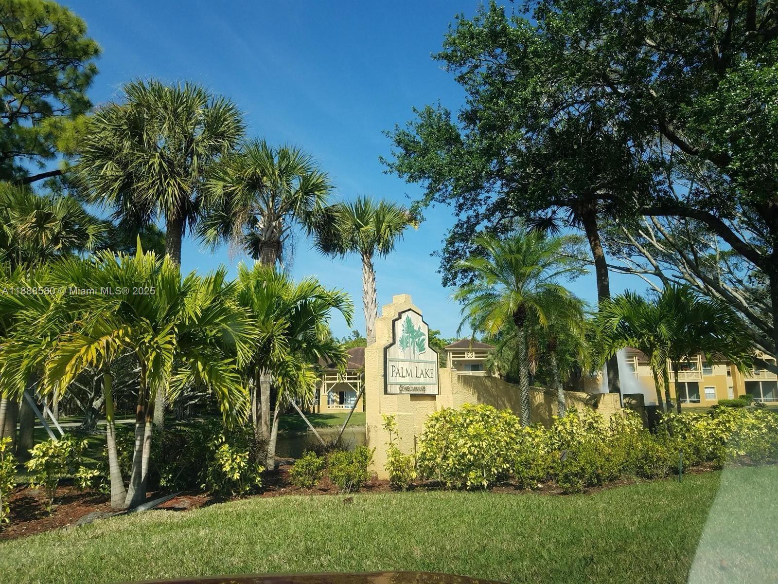 4863 Via Palm Lakes, Unit 806 West Palm Beach, FL 33417 - Photo 2 of 23 a view of a garden with a house