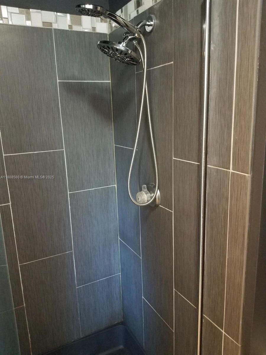 4863 Via Palm Lakes, Unit 806 West Palm Beach, FL 33417 - Photo 6 of 23 a bathroom with a shower