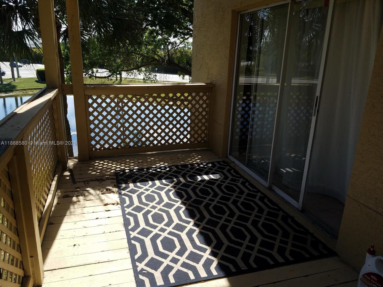 4863 Via Palm Lakes, Unit 806 West Palm Beach, FL 33417 - Photo 9 of 23 a view of a black gate