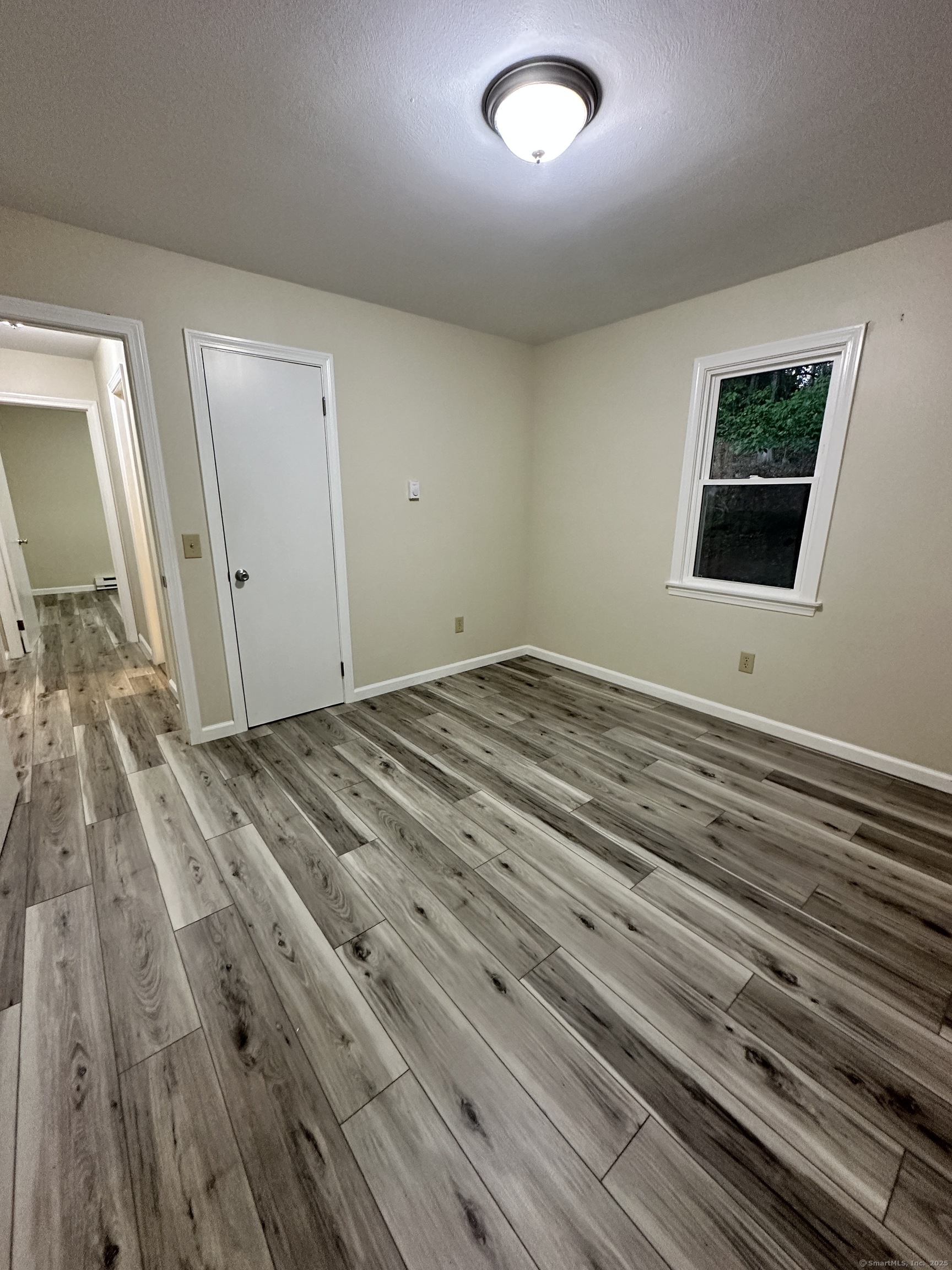 70 Pond Meadow Road Essex, CT 06442 - Photo 12 of 12 a view of a livingroom with wooden floor