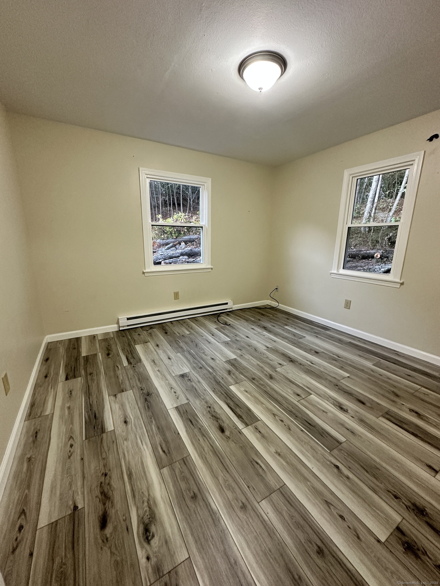 70 Pond Meadow Road Essex, CT 06442 - Photo 6 of 12 a view of wooden floor in a room