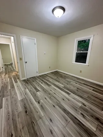 a view of a livingroom with wooden floor