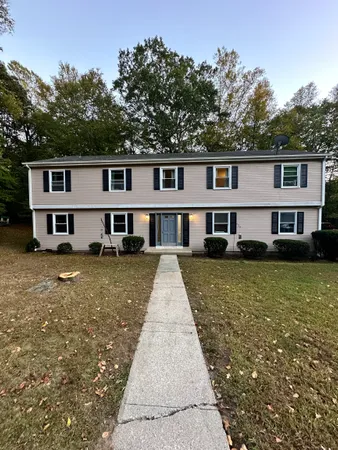 a front view of a house with a yard