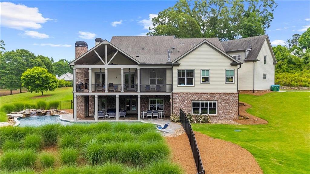 2503 Sugar Pike Road Canton, GA 30115 - Photo 33 of 134 a view of a house with a yard and potted plants