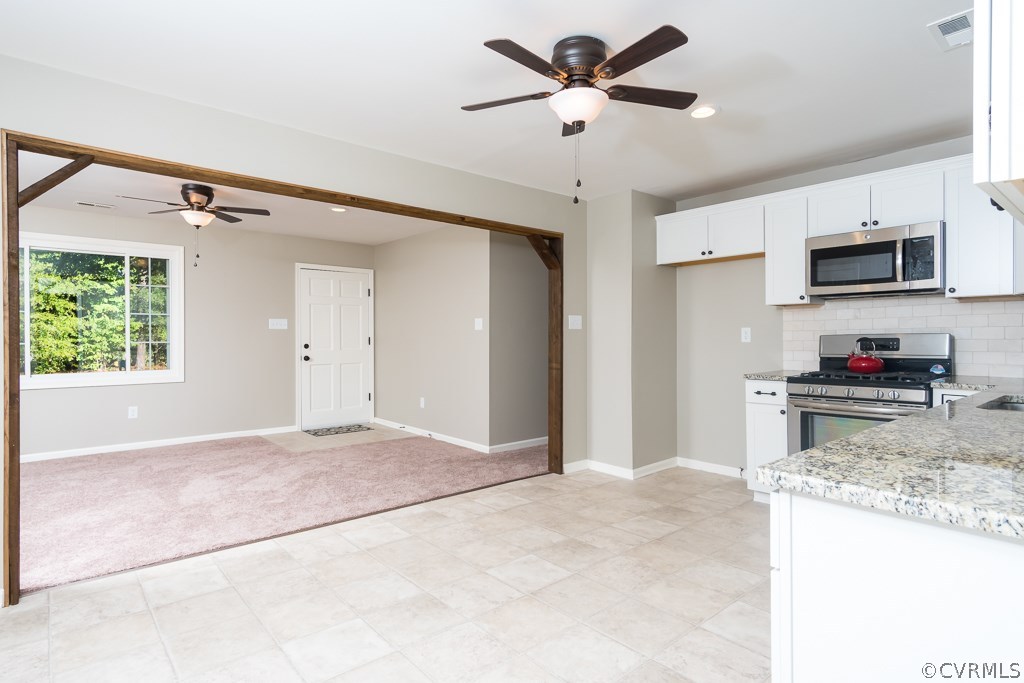 1105 Enon Church Road Chester, VA 23836 - Photo 20 of 34 a view of a kitchen with microwave and a stove