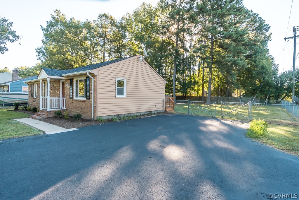 1105 Enon Church Road Chester, VA 23836 - Photo 5 of 34 a view of backyard of house and trees