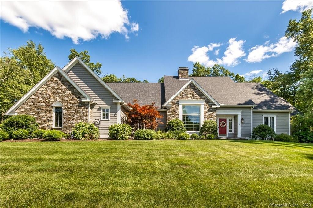 9 Scarborough Road Simsbury, CT 06070 - Photo 1 of 1 a front view of house with yard and green space