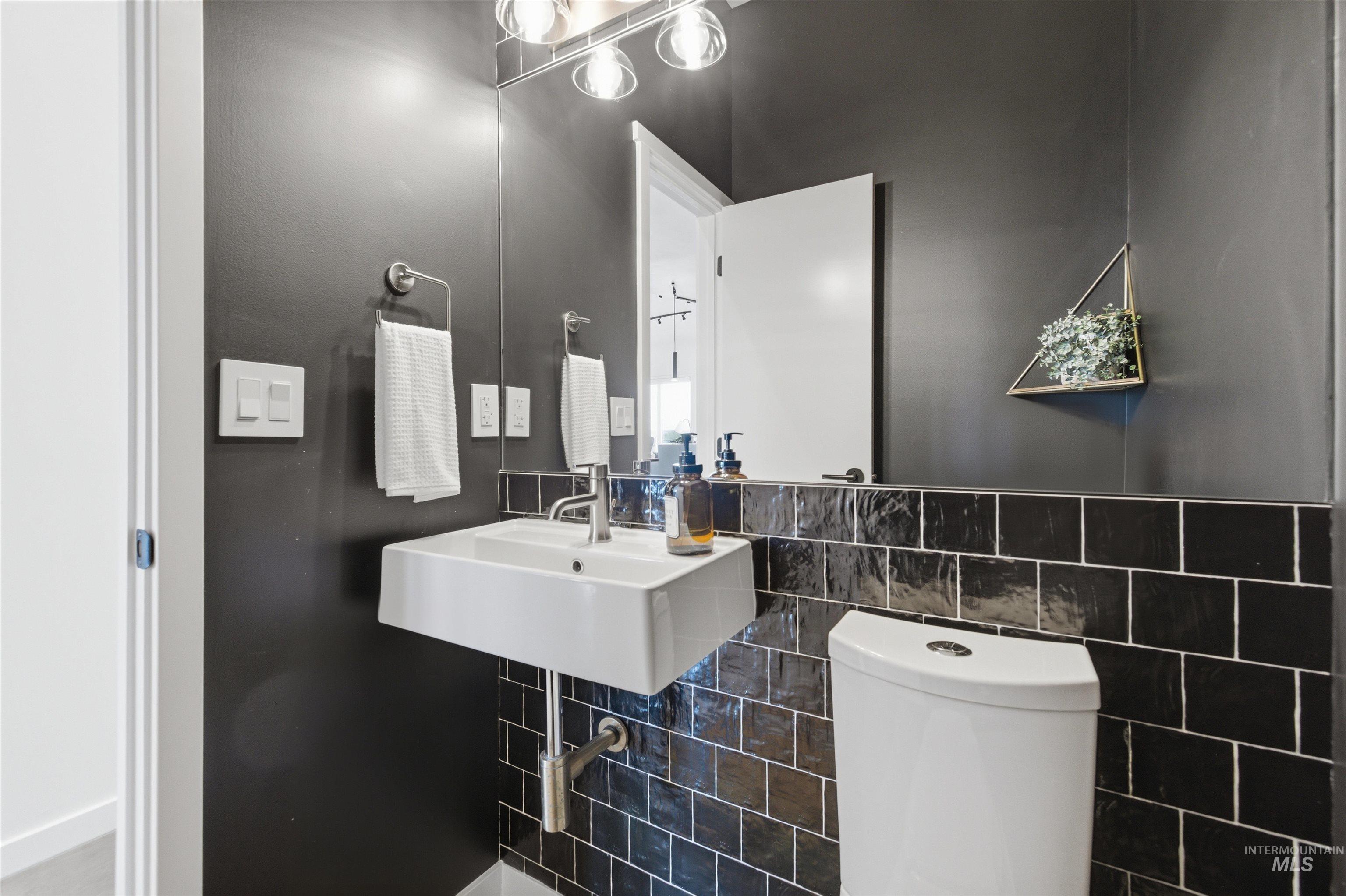 4275 36th Street Boise, ID 83703 - Photo 11 of 50 Half bathroom featuring toilet and tile walls