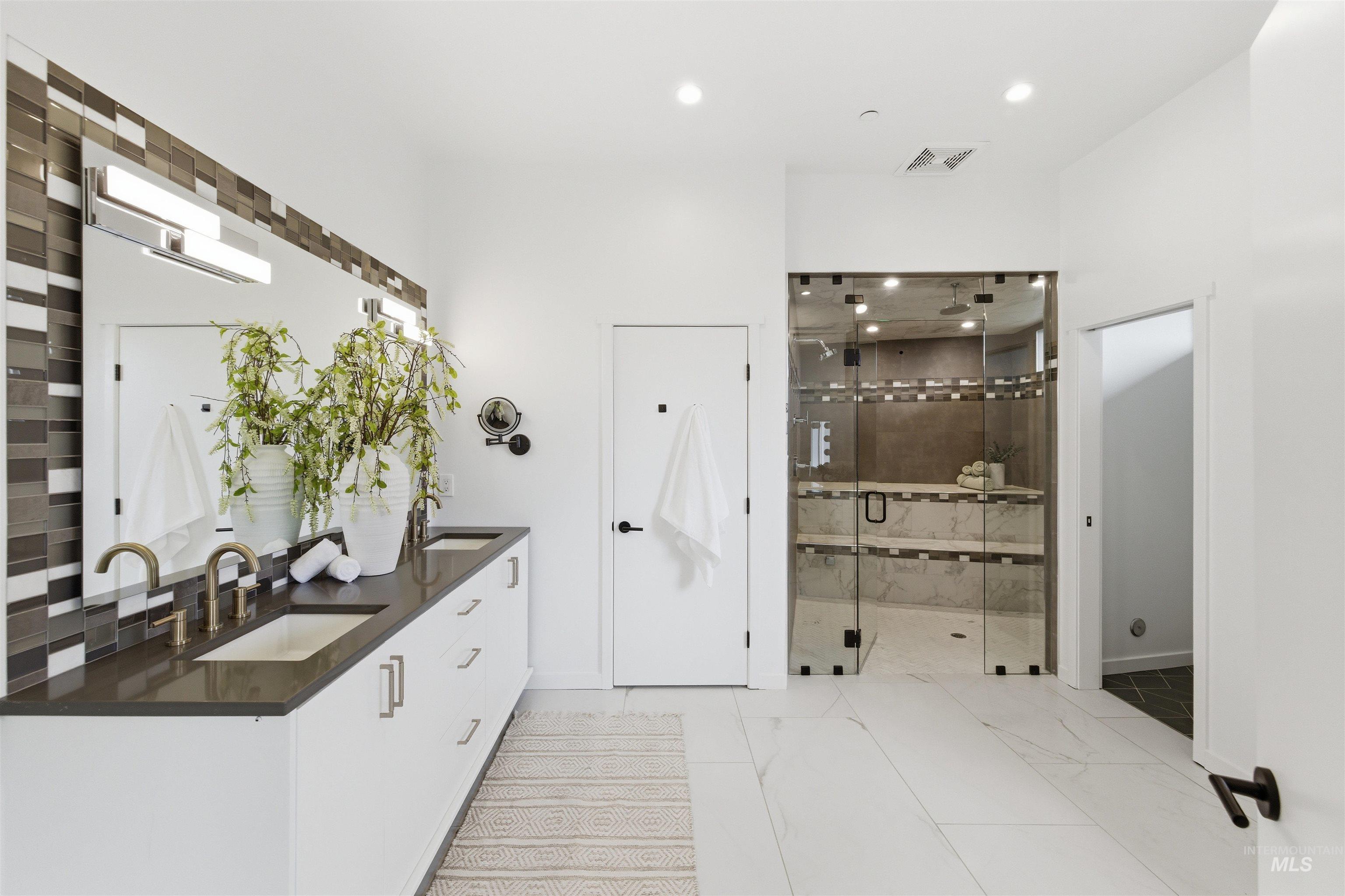 4275 36th Street Boise, ID 83703 - Photo 19 of 50 Full bath featuring double vanity, recessed lighting, a stall shower, and light marble finish floors
