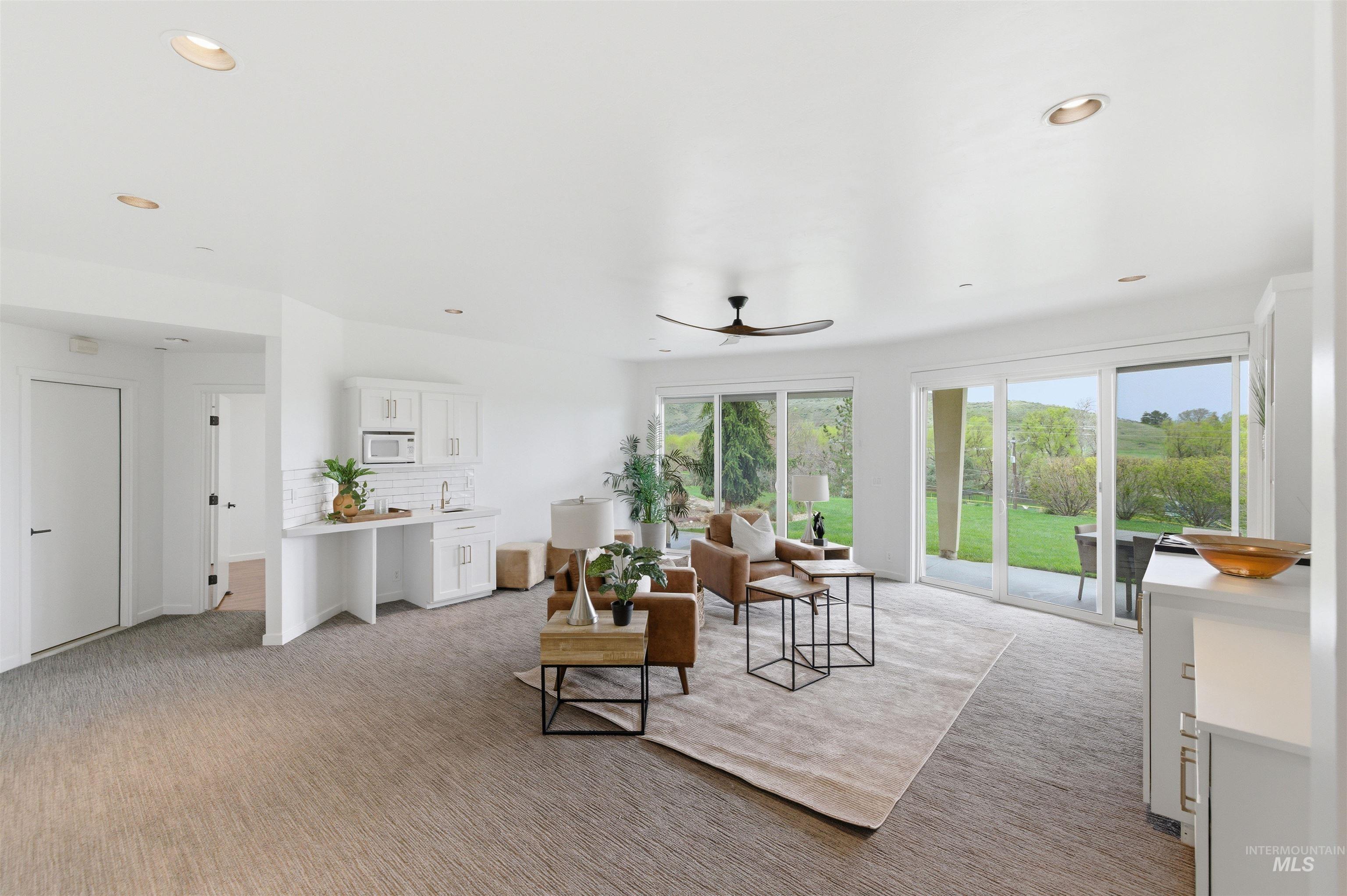 4275 36th Street Boise, ID 83703 - Photo 25 of 50 Living room featuring light carpet, a ceiling fan, and recessed lighting