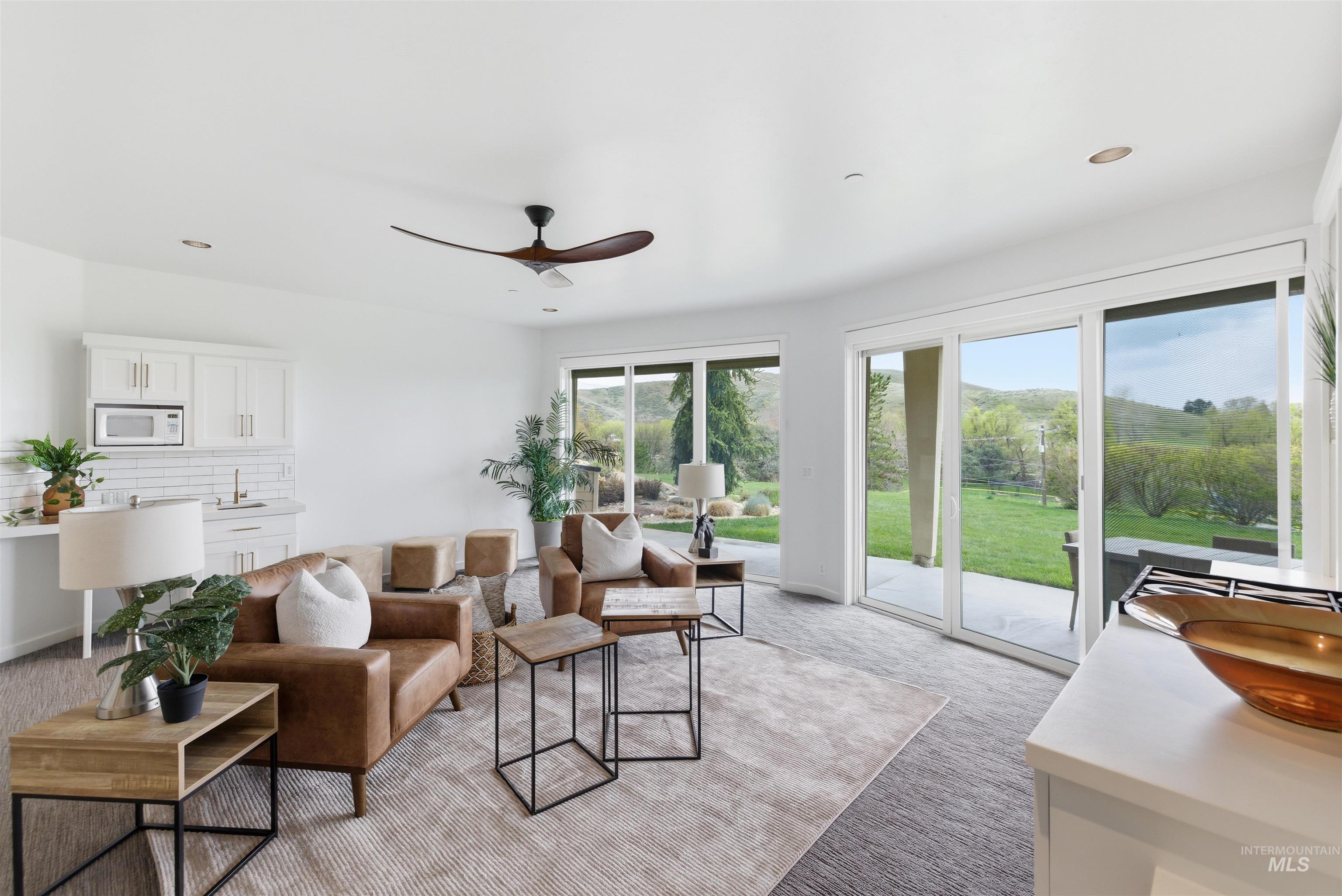 4275 36th Street Boise, ID 83703 - Photo 28 of 50 Living room featuring a ceiling fan, recessed lighting, a mountain view, and light colored carpet