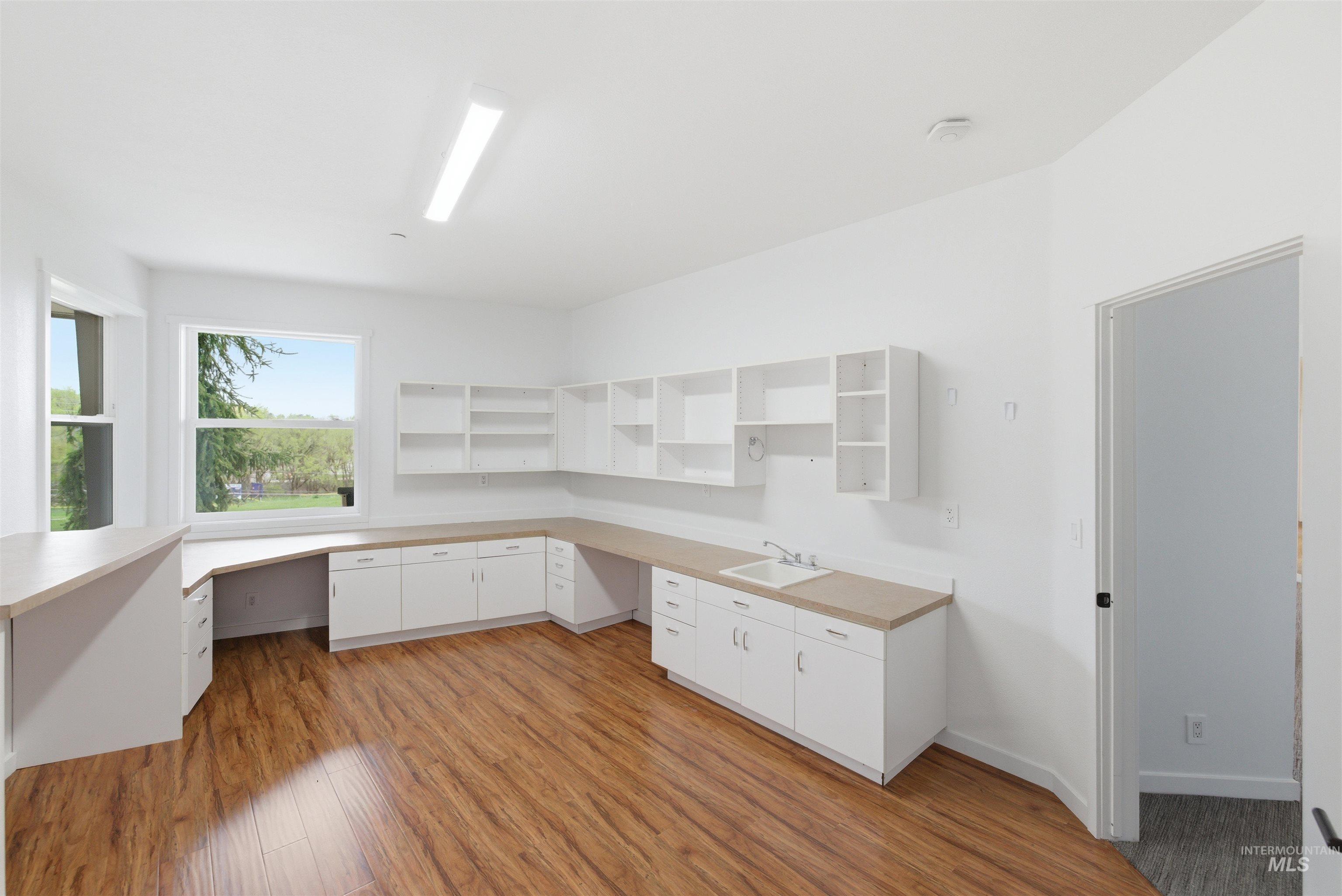 4275 36th Street Boise, ID 83703 - Photo 29 of 50 Unfurnished office with built in desk and light wood-style floors