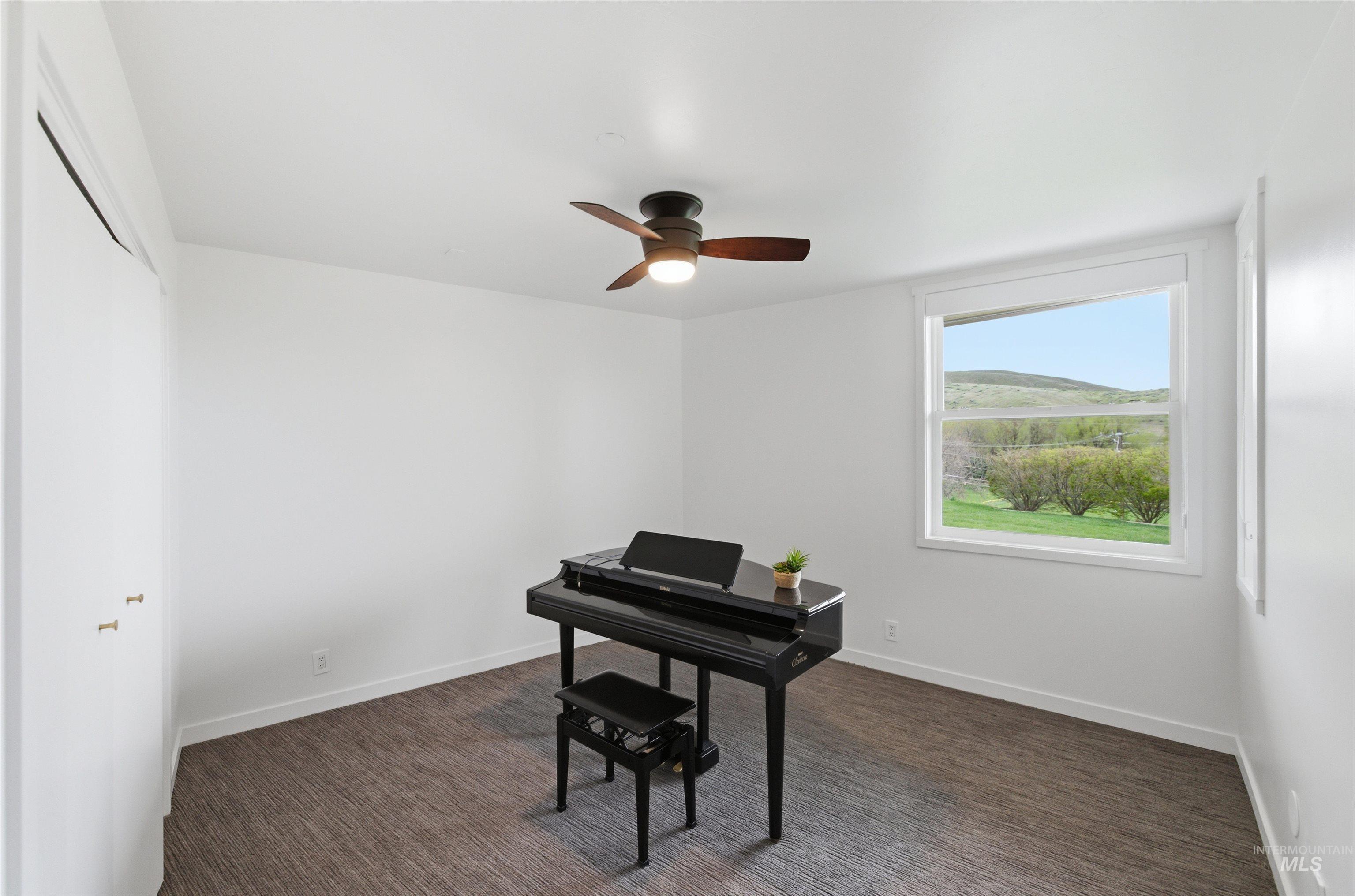 4275 36th Street Boise, ID 83703 - Photo 31 of 50 Office featuring a mountain view, a ceiling fan, and dark colored carpet