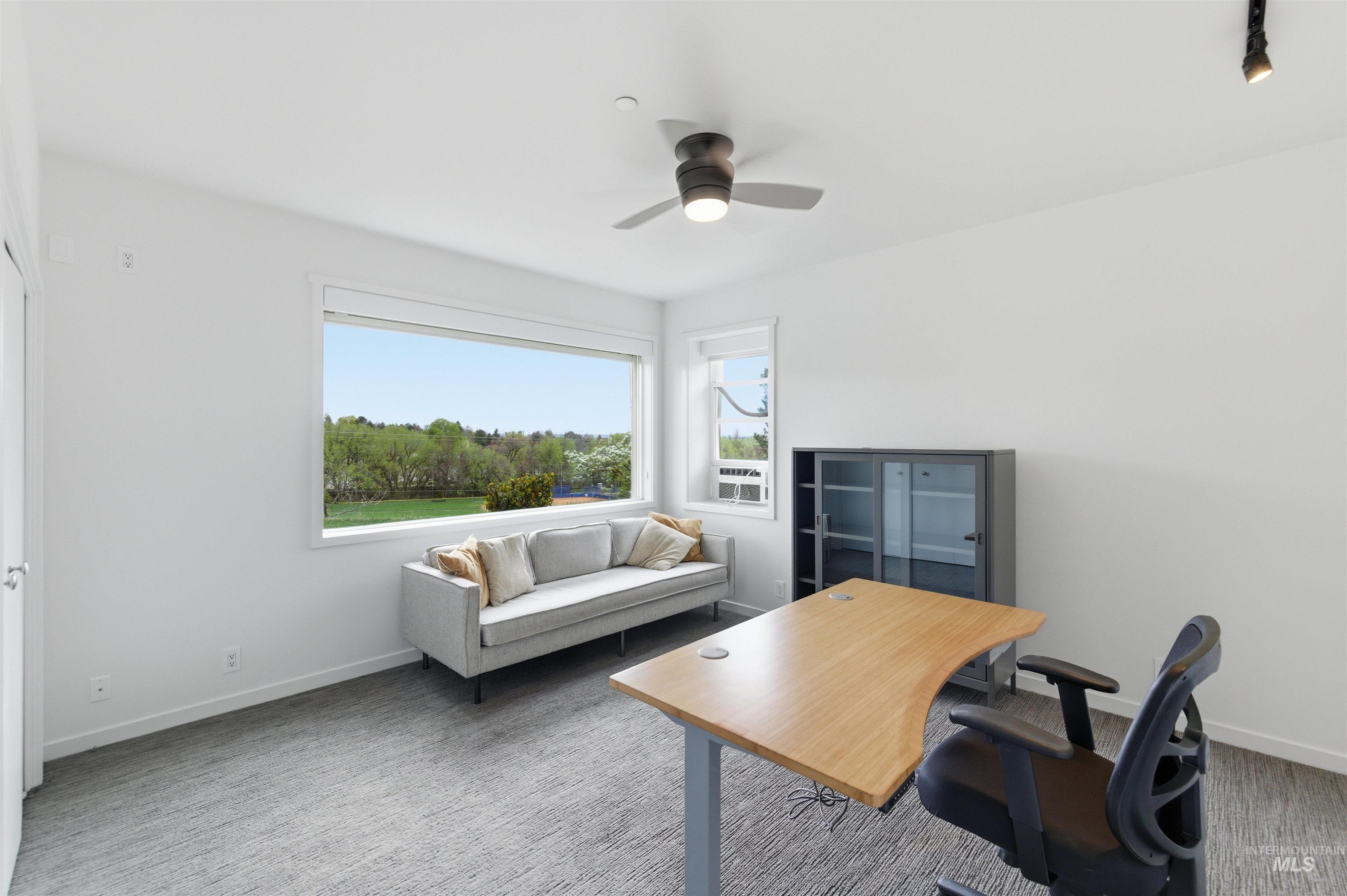 4275 36th Street Boise, ID 83703 - Photo 33 of 50 Carpeted home office with ceiling fan and baseboards