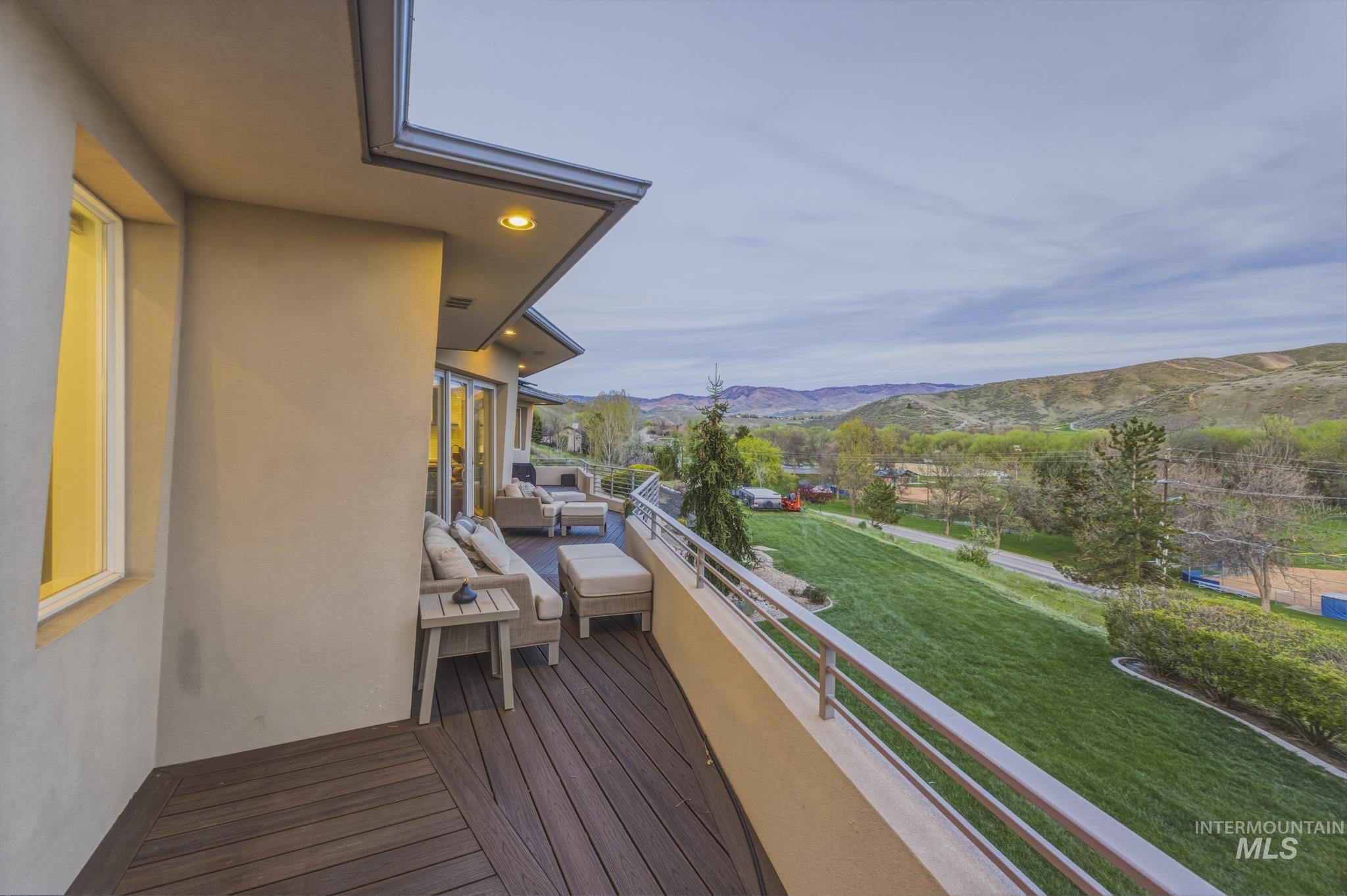 4275 36th Street Boise, ID 83703 - Photo 39 of 50 Deck with a mountain view, a lawn, and an outdoor living space