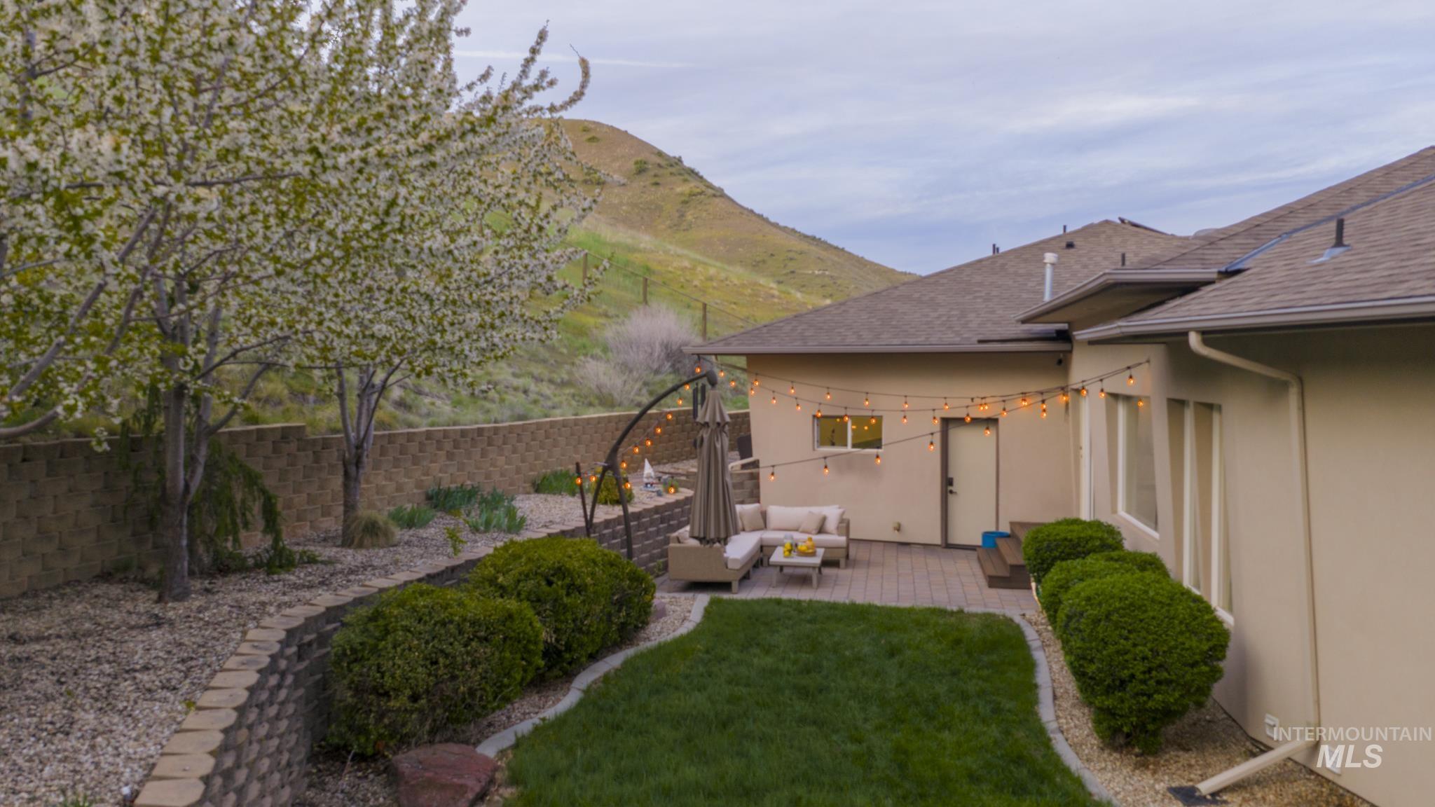 4275 36th Street Boise, ID 83703 - Photo 48 of 50 Fenced backyard featuring a patio area, an outdoor lounge area, and a mountain view