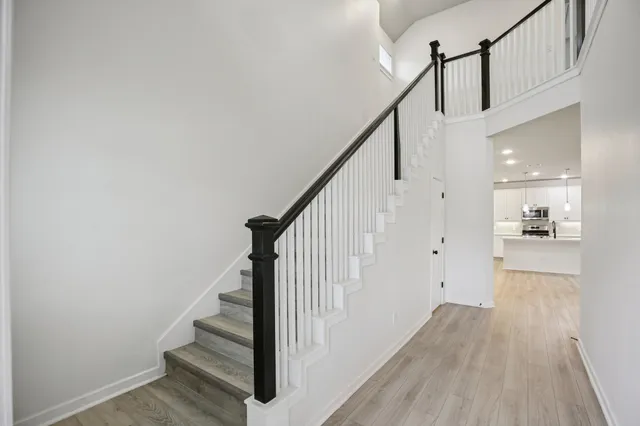 a view of entryway with stairs and wooden floor