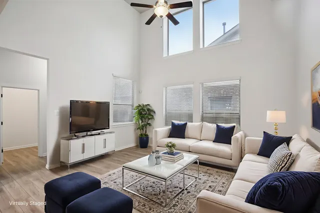 a kitchen with stainless steel appliances kitchen island granite countertop a refrigerator and a stove top oven