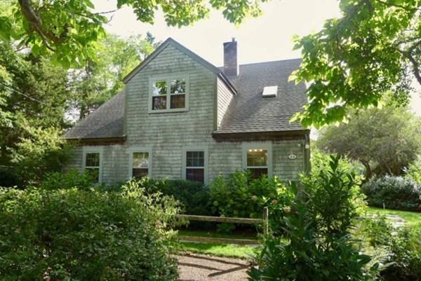 44 Music Street West Tisbury, MA 02568 - Photo 1 of 12 a front view of a house with a yard