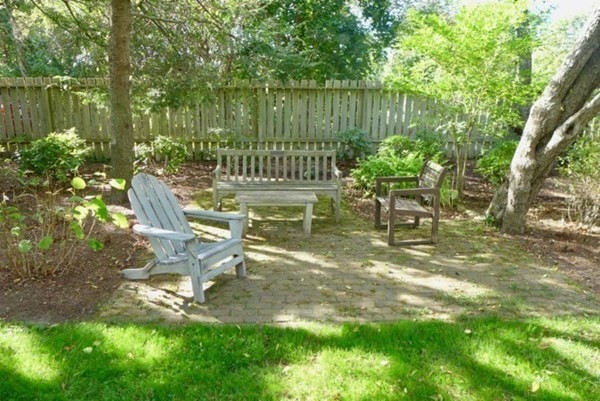 44 Music Street West Tisbury, MA 02568 - Photo 12 of 12 a view of a bench in the garden near a lake