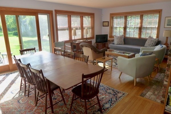 44 Music Street West Tisbury, MA 02568 - Photo 3 of 12 a view of a dining room with furniture wooden floor and a potted plant