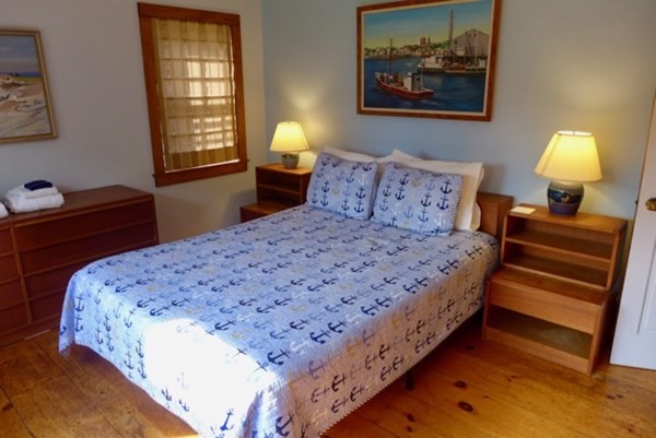 44 Music Street West Tisbury, MA 02568 - Photo 4 of 12 a bedroom with bed and window