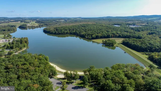 an aerial view of a houses with ocean view