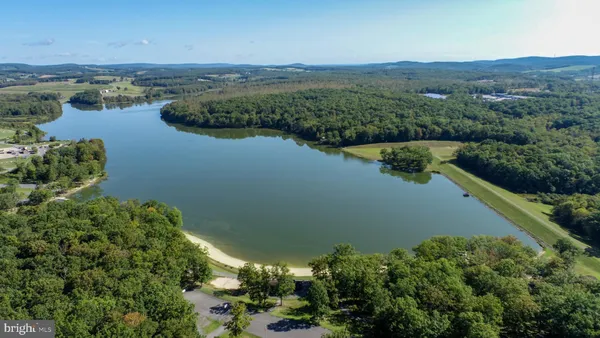 an aerial view of a houses with ocean view