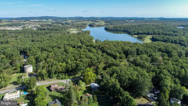 an aerial view of a houses with a yard