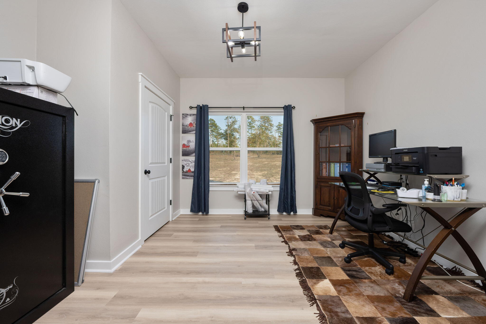 6150 Sherman Kennedy Road Baker, FL 32531 - Photo 12 of 43 a view of a livingroom with workspace and a window