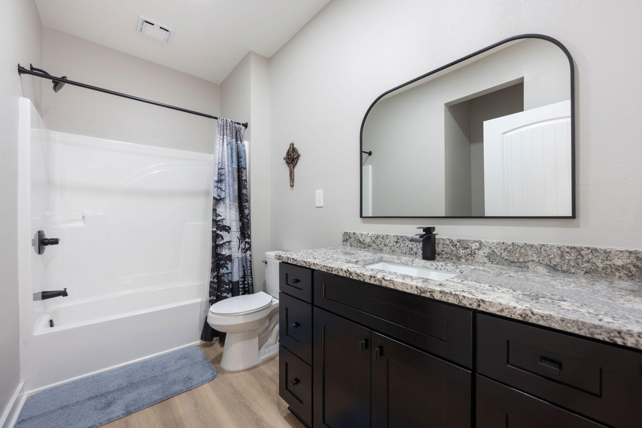 6150 Sherman Kennedy Road Baker, FL 32531 - Photo 13 of 43 a bathroom with a granite countertop sink mirror toilet and bathtub
